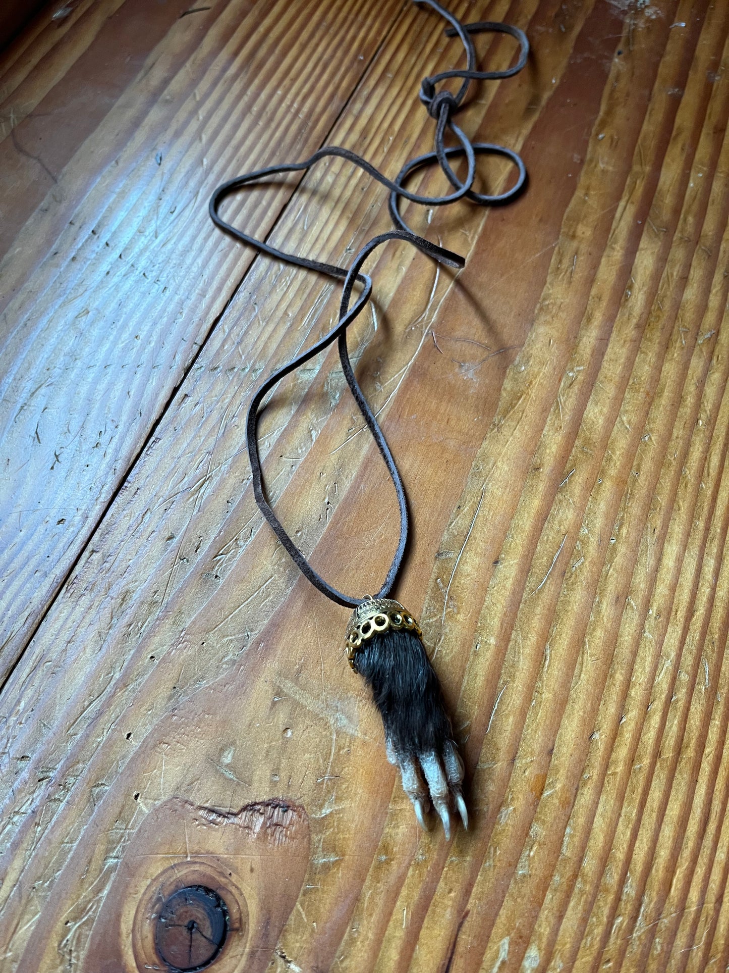 Raccoon paw necklace