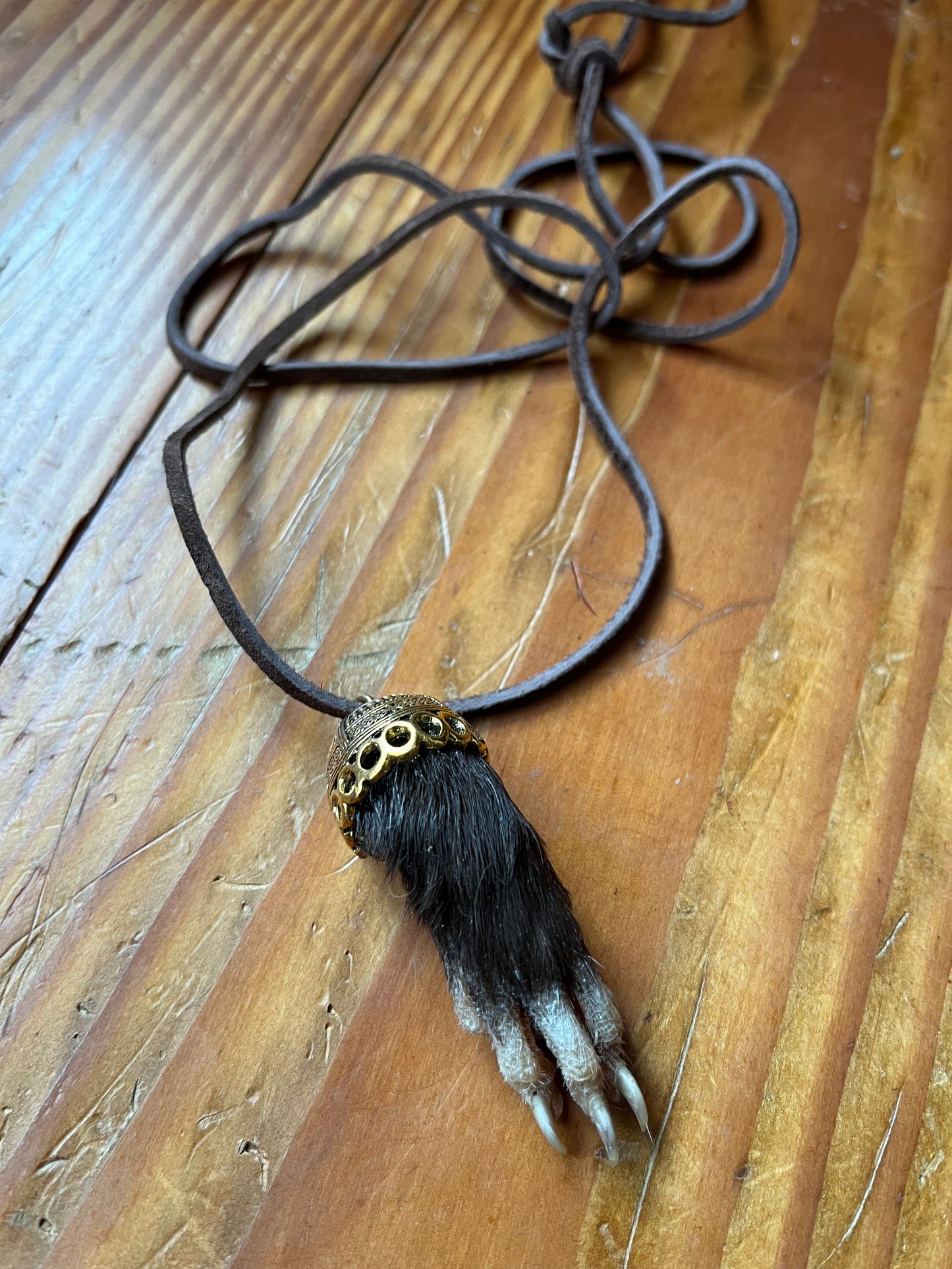 Raccoon paw necklace